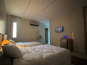 Krevet ili kreveti u jedinici u objektu Hapi Pyramids Hotel