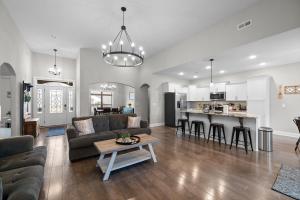 a living room with a couch and a table at The Clubhouse on Colston, by Byers & Harvey in Clarksville