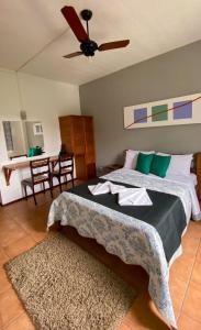 Cama ou camas em um quarto em Pousada 3 Corações Penedo