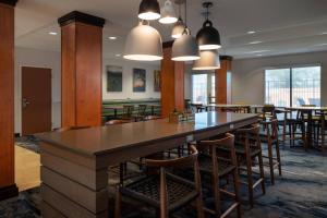 a dining room with a large table and chairs at Fairfield Inn & Suites Redding in Redding