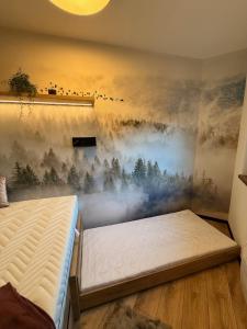 Postel nebo postele na pokoji v ubytování Apartmány KAMZÍK Donovaly + 37 fotografií