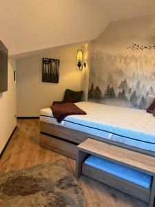 Postel nebo postele na pokoji v ubytování Apartmány KAMZÍK Donovaly