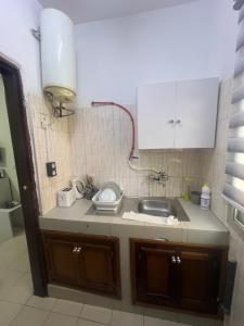 O bucătărie sau chicinetă la Chez Zeina - Studio Centre Ville +9 fotografii