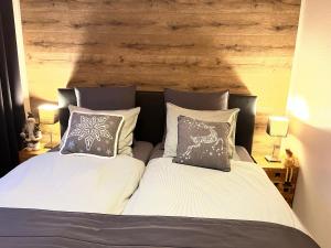 Ein Bett oder Betten in einem Zimmer der Unterkunft Le Chalet de Marguerite