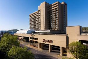 a large building with a train station in front of it at Charleston Marriott Town Center in Charleston