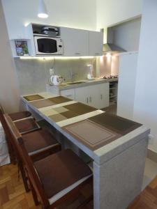 a small kitchen with a counter and a sink at Copacabana wonderful apartment in Rio de Janeiro