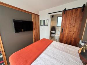 Ένα ή περισσότερα κρεβάτια σε δωμάτιο στο Flax Pod 41