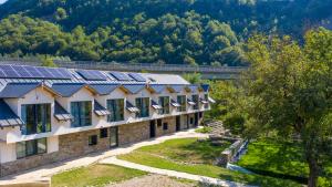 an image of a building with solar panels on it at Yabbadabbadoo in Siriu