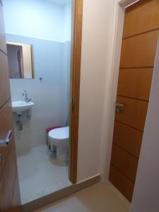 a bathroom with a toilet and a sink at Copacabana wonderful apartment in Rio de Janeiro