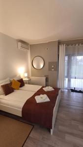 Katil atau katil-katil dalam bilik di Neferprod Apartments - IS - CAM 04
