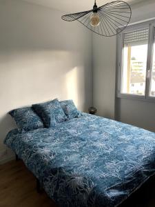 En eller flere senge i et værelse på Le Marilyn - 2 Bedrooms