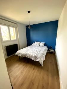 En eller flere senge i et værelse på Le Marilyn - 2 Bedrooms