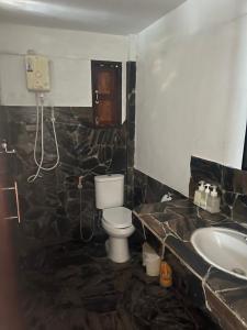 a bathroom with a toilet and a sink at Pimmada Hut in Haad Pleayleam +189 photos