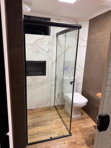 Ένα μπάνιο στο Pousada recanto do canário suite 2 Dallas