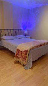 En eller flere senge i et værelse på Comfort Corner