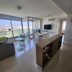 a kitchen and living room with a view of a city at Gala Vista in Punta del Este