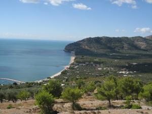 a view of a beach and the ocean at Mattinata Camping in Mattinata