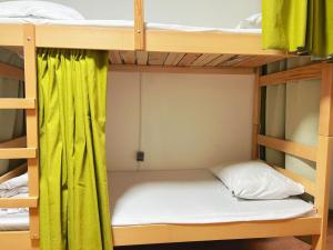 Postel nebo postele na pokoji v ubytování Eleven Hostel