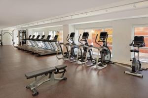 a gym with rows of exercise bikes and treadmills at Cincinnati Marriott at RiverCenter in Covington