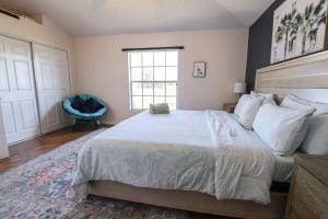 a bedroom with a large bed and a window at New APT 15Min Drive Disney and Airport - Parks KingBed Pets in Kissimmee