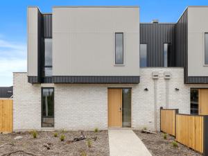 a house with black and white brick at Wirilda Retreat in Inverloch