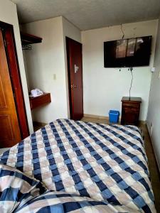Un pat sau paturi într-o cameră la Hotel Class