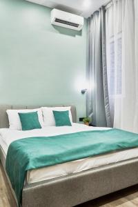 Posteľ alebo postele v izbe v ubytovaní NAVI Residence Erzsebet