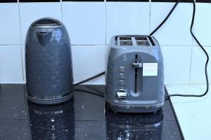 a toaster and a blender sitting on a counter at Tranquil Stays at 3 bedroom House in Dagenham in Dagenham