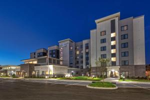 a building with a parking lot in front of it at Residence Inn by Marriott Nashville at Opryland in Nashville