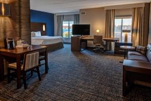 a hotel room with a bed and a desk at Residence Inn by Marriott Nashville at Opryland in Nashville