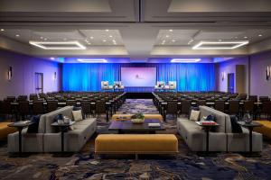 a large room with chairs and a projection screen at Ventura Beach Marriott in Ventura +33 photos