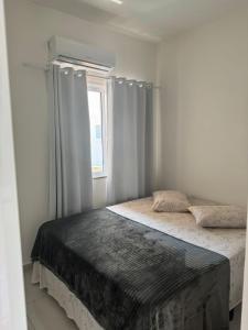 Postel nebo postele na pokoji v ubytování Casa na praia de Zimbros