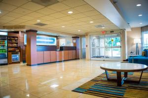 a lobby with a table in the middle of a room at Fairfield Inn & Suites by Marriott Knoxville/East in Knoxville +7 photos