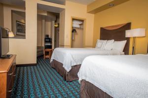 a hotel room with two beds and a television at Fairfield Inn & Suites by Marriott Knoxville/East in Knoxville