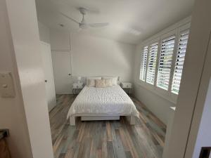 Ένα ή περισσότερα κρεβάτια σε δωμάτιο στο K'Gari House Eurong