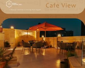 Een restaurant of ander eetgelegenheid bij Mirage pyramids view hotel