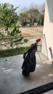a person squatting on a sidewalk with a bag at Sunny 2-bed condo - fast WIFI in Puntarenas
