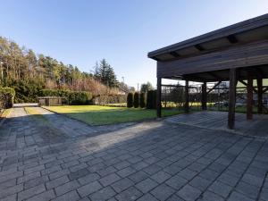 a patio with a pavilion in a park at Apartment Pohorje Sun - whole house in Maribor