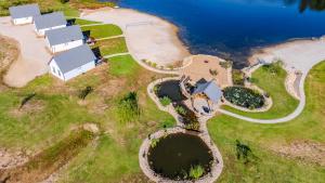 an aerial view of a house on an island next to the water at Luxury Cabin in The Country With King Bed and Loft #1 in Point