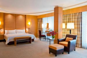 a hotel room with a bed and a desk and chair at Lugal, a Luxury Collection Hotel, Ankara in Ankara +67 photos