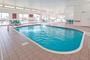 a pool in a hospital room with blue chairs at Residence Inn Canton in North Canton
