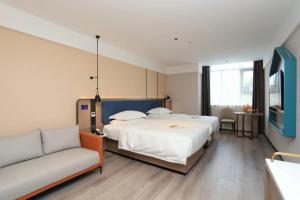 Letto o letti in una camera di Guangzhou Yilin Hotel - Xiaogang metro Store