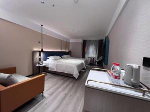Letto o letti in una camera di Guangzhou Yilin Hotel - Xiaogang metro Store