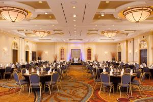 a banquet hall with tables and chairs in a ballroom at Greenville Marriott in Greenville +31 photos