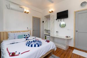 Letto o letti in una camera di Olhumathi View Inn
