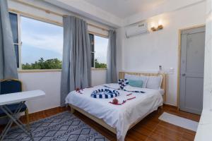 Letto o letti in una camera di Olhumathi View Inn