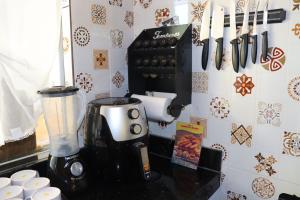 a kitchen counter with a blender on a counter top at Casa Ori Lar Boipeba in Ilha de Boipeba +20 photos
