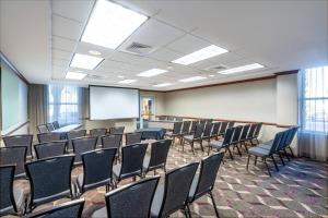 a room with chairs and a whiteboard in a room at Residence Inn by Marriott Charleston Airport in Charleston