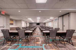 a large conference room with tables and chairs in it at Residence Inn by Marriott Charlotte Airport in Charlotte +22 photos