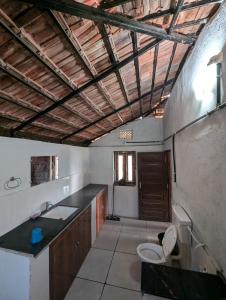 a bathroom with a sink and a toilet in it at Shivakashi Homestay in Maheshwar +72 photos